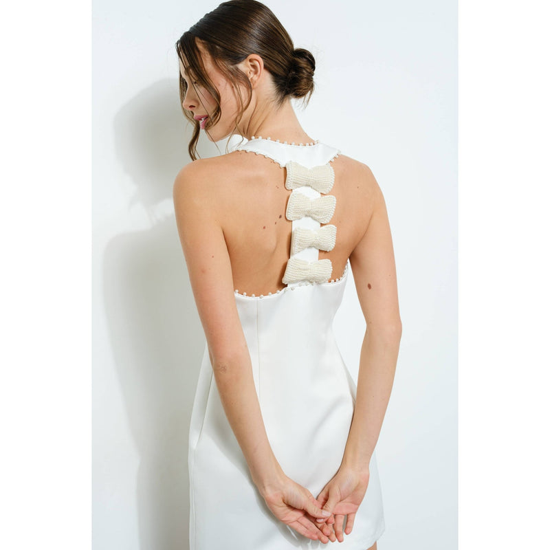 Buy White Sleeveless Pearl Embellished Bow Back Mini Dress Online | Sissy Boutique Buy White Sleeveless Pearl Embellished Bow Back Mini Dress Online | Sissy Boutique