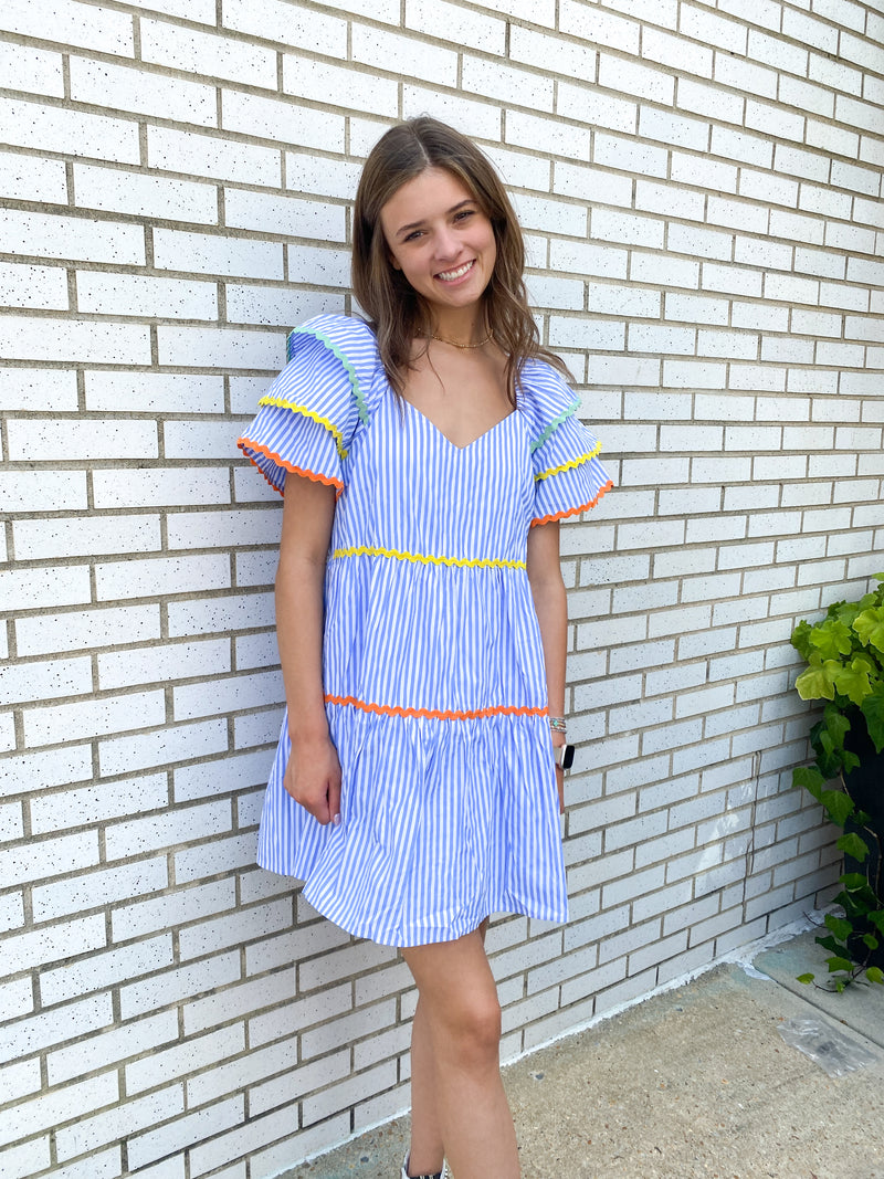 NAVY SEERSUCKER STRIPED AND MULTI-COLORED RIC RAC DRESS