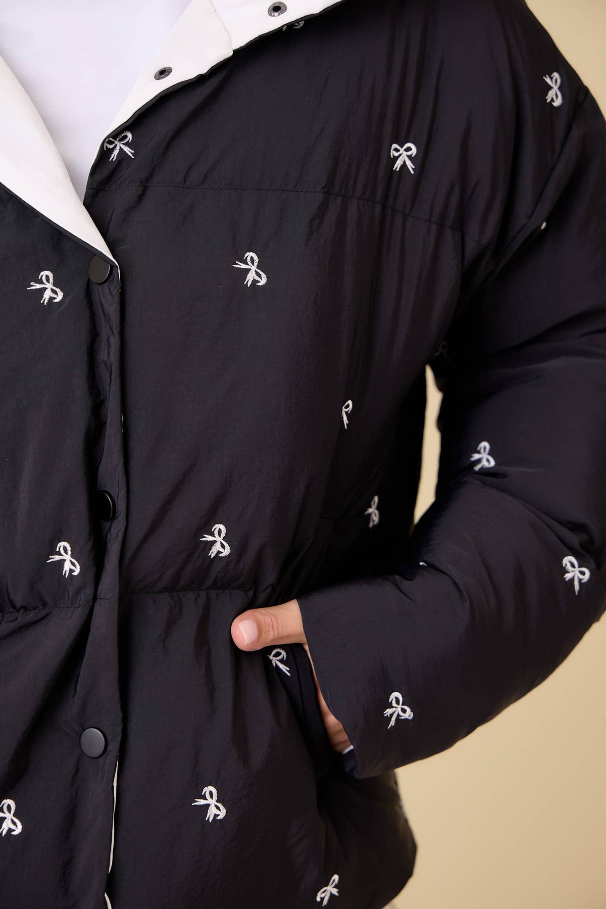 Black Ribbon Bow Embroidered Puffer Jacket | Main Strip