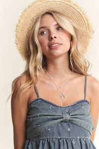 BOW ACCENT DISTRESSED WASHED DENIM CAMISOLE TOP WITH ADJUSTABLE STRAPS AND EYELET DETAIL | Madelyn