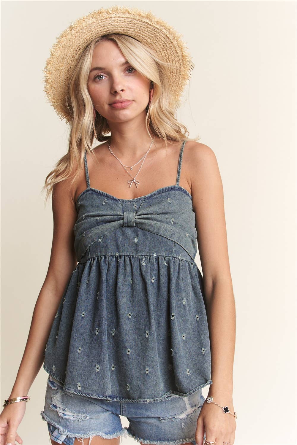 BOW ACCENT DISTRESSED WASHED DENIM CAMISOLE TOP WITH ADJUSTABLE STRAPS AND EYELET DETAIL | Madelyn