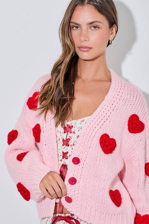 pink-knitted-cardigan-with-red