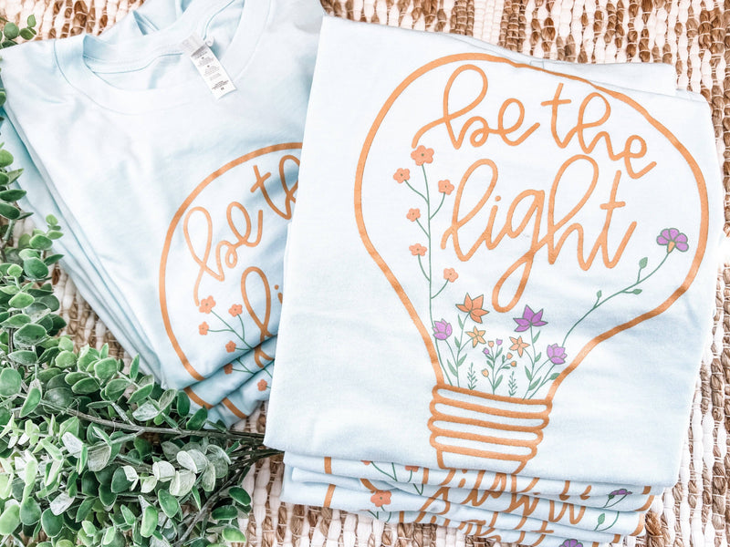 BE THE LIGHT | HEATHER ICE BLUE | GRAPHIC TEE SHORT SLEEVE-Small Town Society Apparel Co.-Sissy Boutique